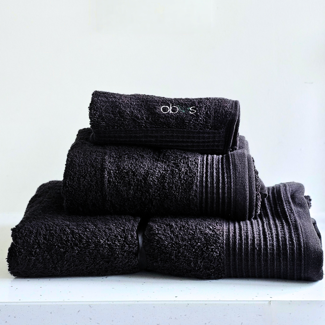 Indulge in the ultimate luxury with the Obvs at Home GOTS Certified Organic Towel Bundle. Crafted from the softest organic cotton, this collection—featuring a bath towel, hand towel, and Obvs face cloth—wraps you in pure, soothing comfort. The plush texture caresses your skin, elevating your daily ritual to an experience of serene indulgence. Eco-friendly and exquisitely soft, these towels are a true testament to sustainable luxury. Perfect for those who seek both indulgence and mindfulness in every moment.