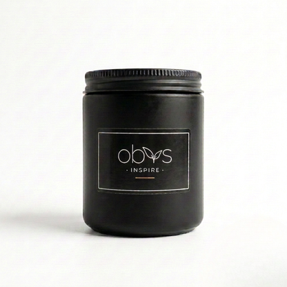 Black jar with a label on a white background