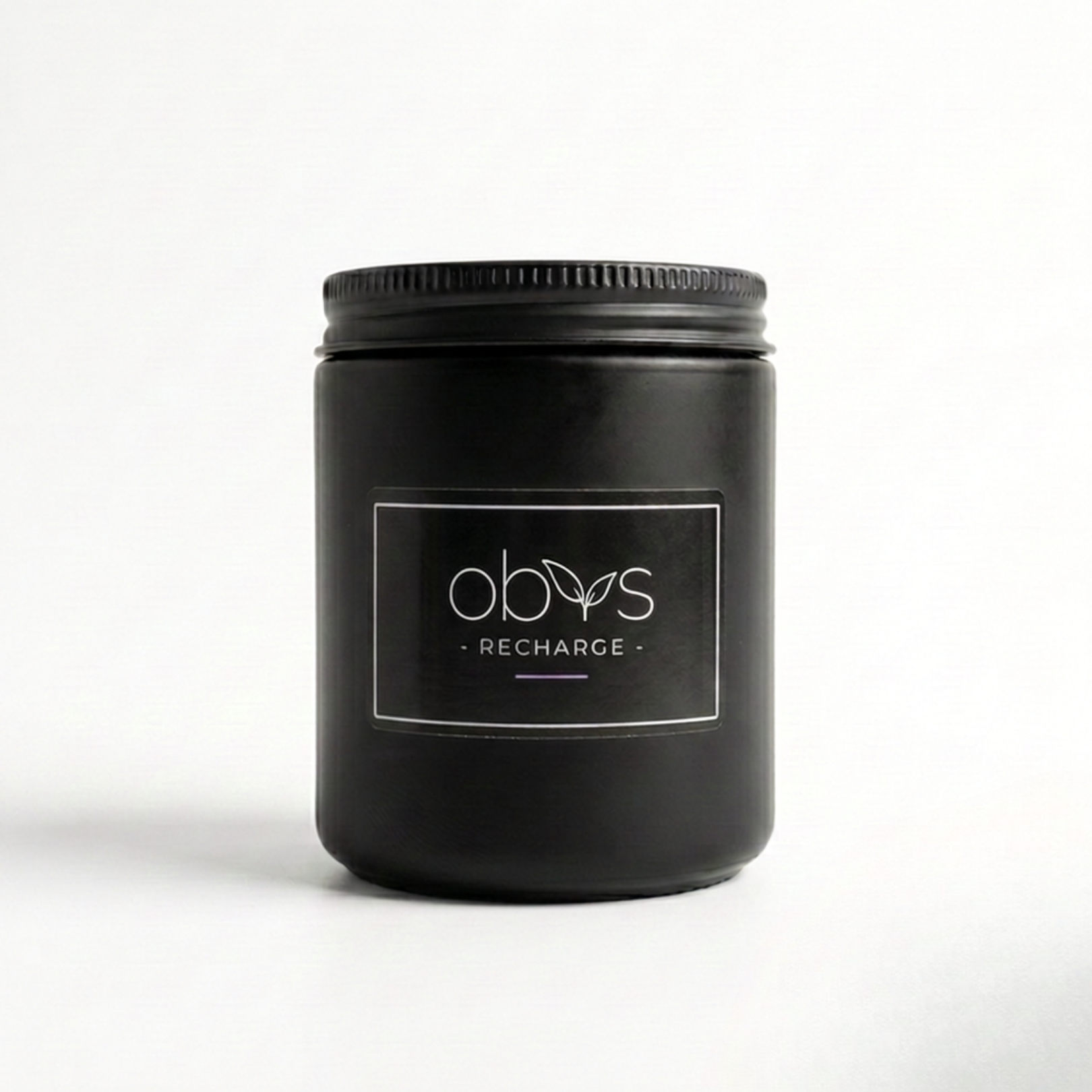 Black candle with Obvs' label on a white background