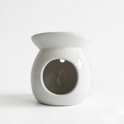 White ceramic oil burner on a white background