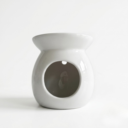White ceramic oil burner on a white background