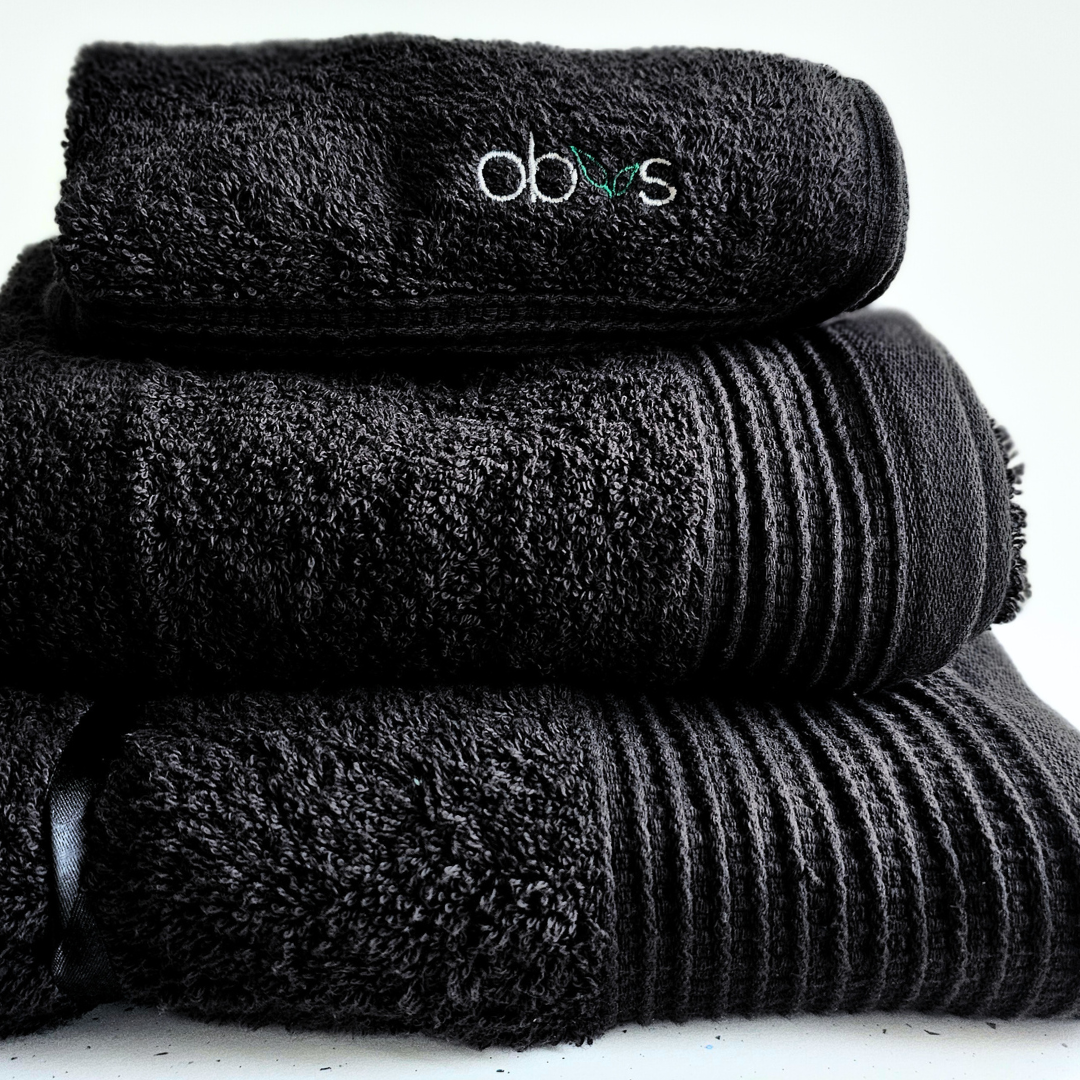 Indulge in the ultimate luxury with the Obvs at Home GOTS Certified Organic Towel Bundle. Crafted from the softest organic cotton, this collection—featuring a bath towel, hand towel, and Obvs face cloth—wraps you in pure, soothing comfort. The plush texture caresses your skin, elevating your daily ritual to an experience of serene indulgence. Eco-friendly and exquisitely soft, these towels are a true testament to sustainable luxury. Perfect for those who seek both indulgence and mindfulness in every moment.