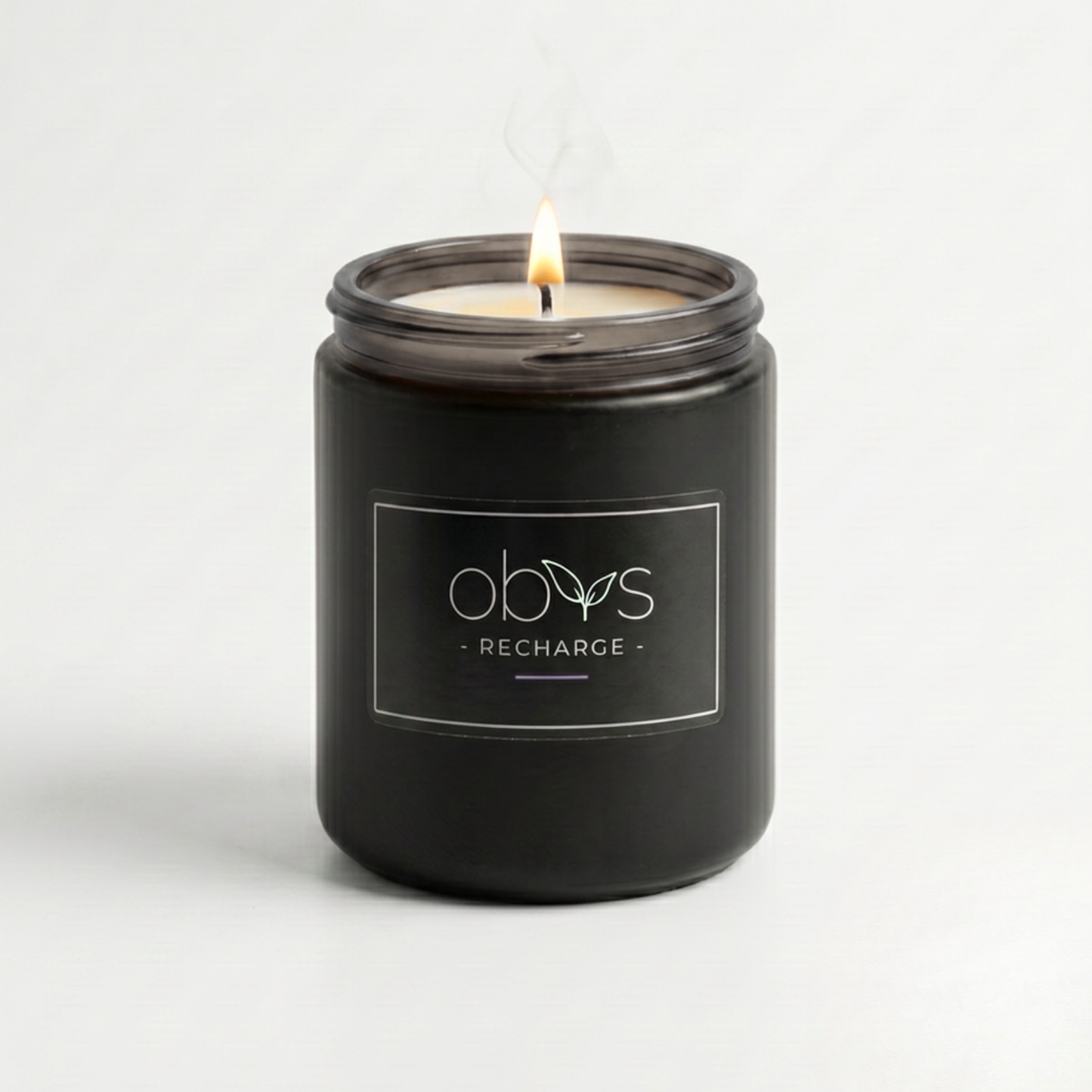 Black candle jar with 'obvs' branding on a white background