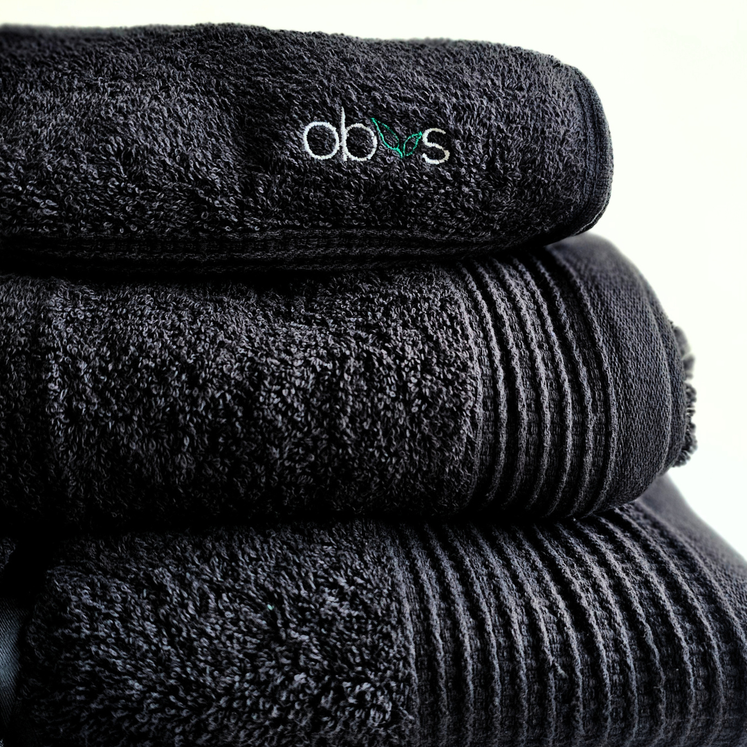 Indulge in the ultimate luxury with the Obvs at Home GOTS Certified Organic Towel Bundle. Crafted from the softest organic cotton, this collection—featuring a bath towel, hand towel, and Obvs face cloth—wraps you in pure, soothing comfort. The plush texture caresses your skin, elevating your daily ritual to an experience of serene indulgence. Eco-friendly and exquisitely soft, these towels are a true testament to sustainable luxury. Perfect for those who seek both indulgence and mindfulness in every moment.