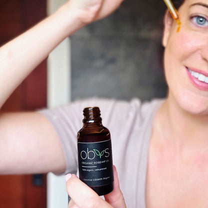 organic rosehip oil bottle with amber hue rich in essential fatty acids vitamins A C and E for anti aging hydration and skin repair