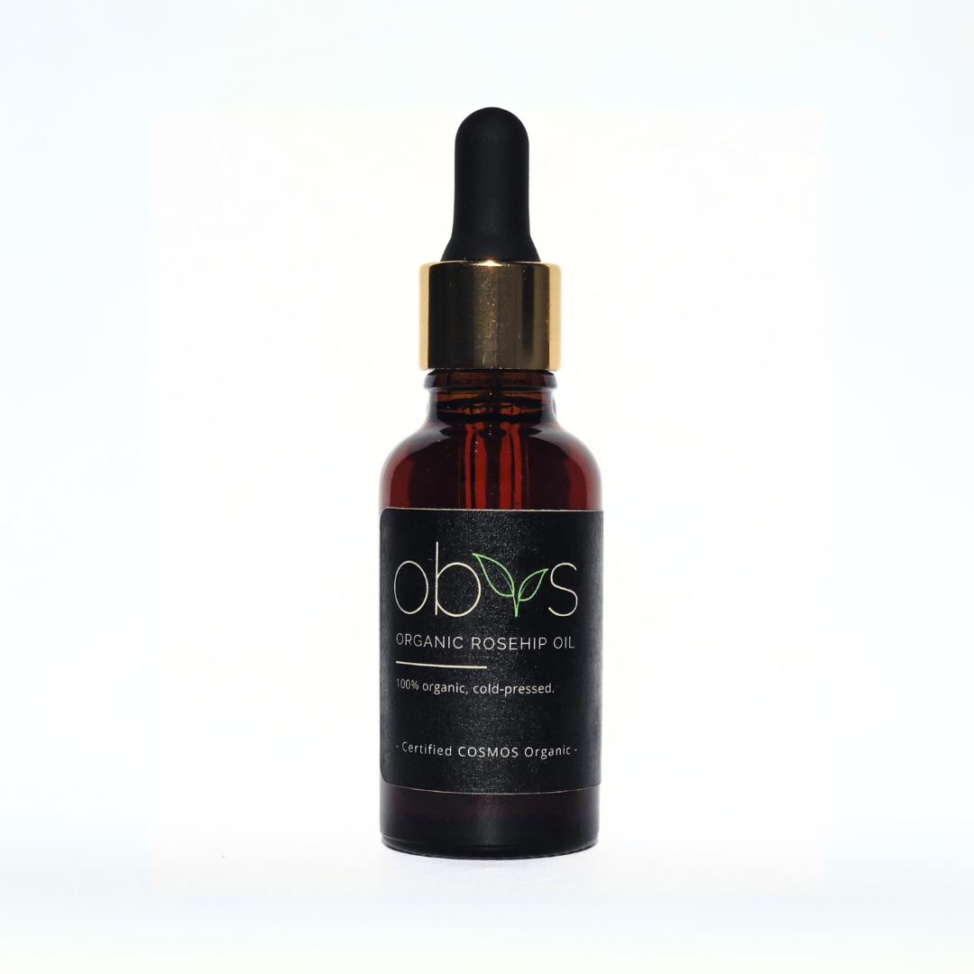 organic rosehip oil bottle with amber hue rich in essential fatty acids vitamins A C and E for anti aging hydration and skin repair