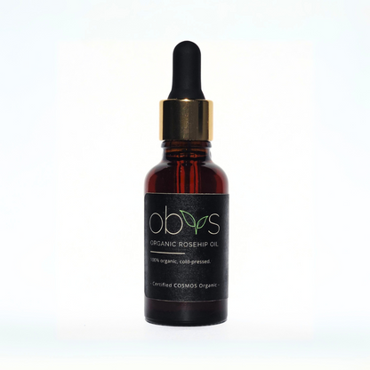 organic rosehip oil bottle with amber hue rich in essential fatty acids vitamins A C and E for anti aging hydration and skin repair