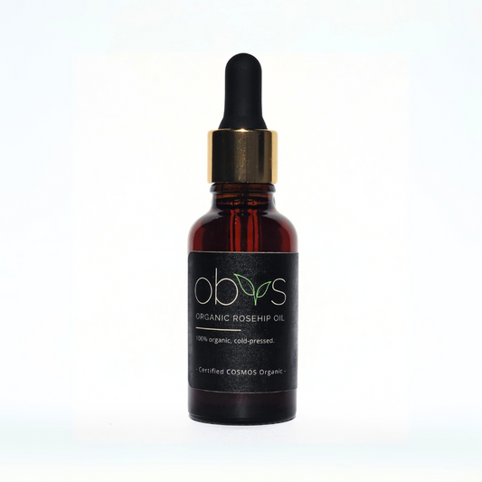 organic rosehip oil bottle with amber hue rich in essential fatty acids vitamins A C and E for anti aging hydration and skin repair