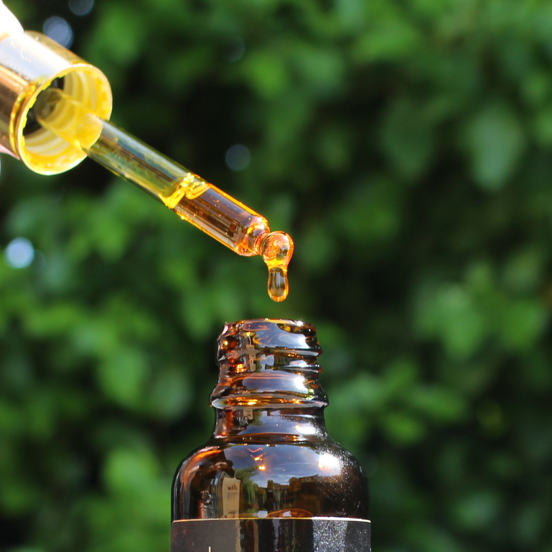 organic rosehip oil bottle with amber hue rich in essential fatty acids vitamins A C and E for anti aging hydration and skin repair