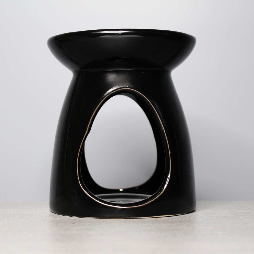 Elevate your home fragrance with our Black Ceramic Wax Burner. Simple yet stylish, this ceramic burner is perfect for releasing the scent of your favourite wax melts, creating a cozy atmosphere. Just pop a tealight inside and place your wax melt on top to fill your space with fragrance.