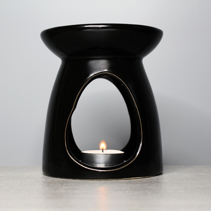 Elevate your home fragrance with our Black Ceramic Wax Burner. Simple yet stylish, this ceramic burner is perfect for releasing the scent of your favourite wax melts, creating a cozy atmosphere. Just pop a tealight inside and place your wax melt on top to fill your space with fragrance.